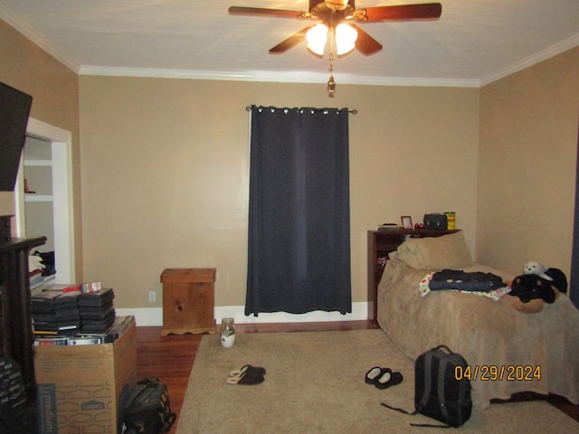 bedroom featuring ceiling fan and ornamental molding