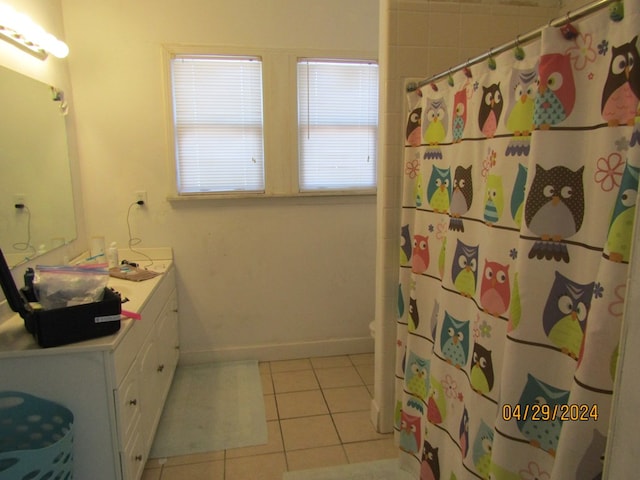 bathroom featuring vanity, a shower with curtain, tile patterned floors, and toilet