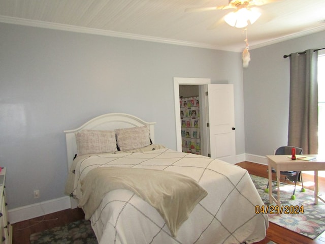 bedroom featuring ornamental molding, hardwood / wood-style floors, and ceiling fan