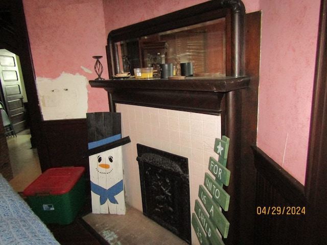 details with a tile fireplace