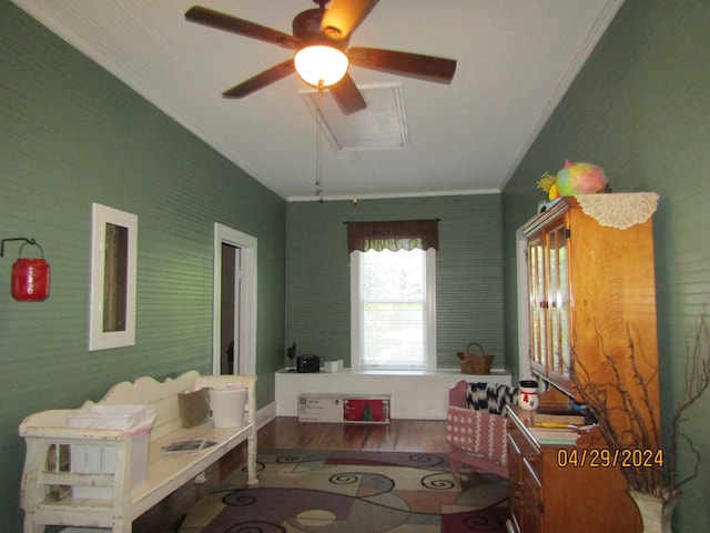 interior space featuring ceiling fan, ornamental molding, and hardwood / wood-style floors