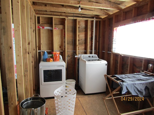 washroom featuring washer and clothes dryer