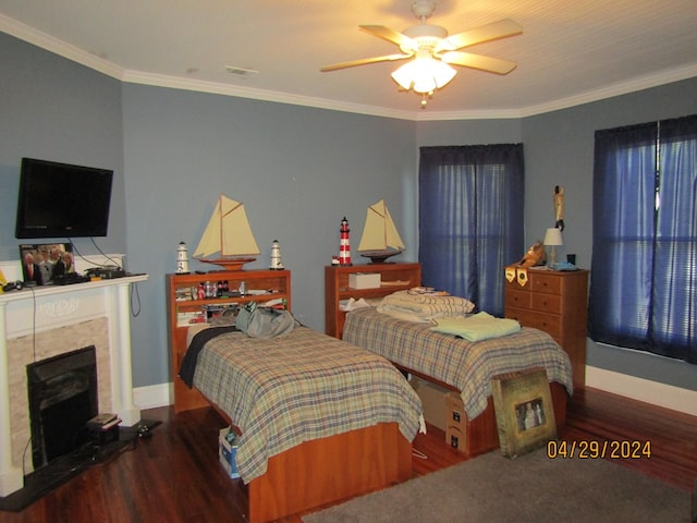 bedroom featuring crown molding, ceiling fan, and dark hardwood / wood-style flooring