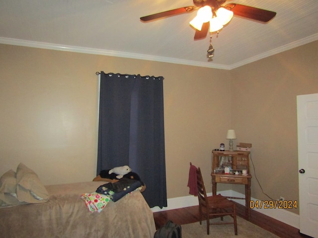 bedroom featuring crown molding and hardwood / wood-style flooring