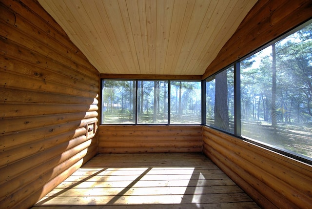 unfurnished sunroom with lofted ceiling and wooden ceiling