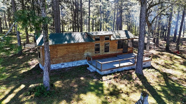 back of property with a wooden deck