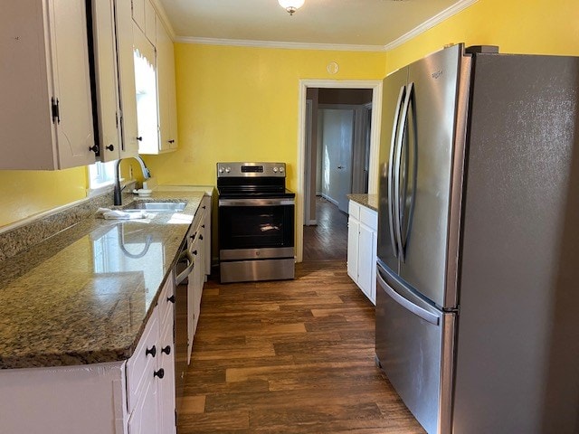 kitchen with white cabinetry, sink, ornamental molding, and appliances with stainless steel finishes