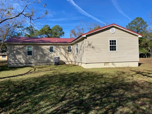 back of house with a yard