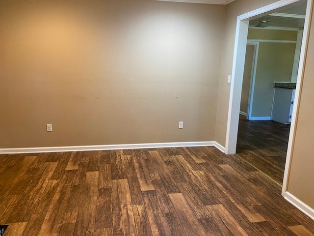 spare room with dark hardwood / wood-style floors