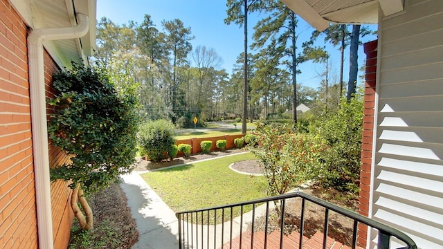 view of yard with a balcony