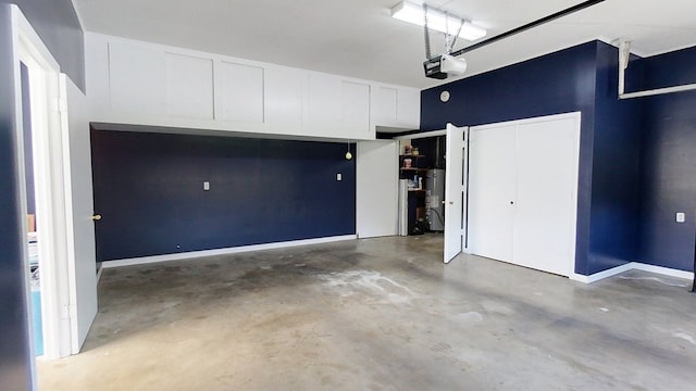 garage with a garage door opener and baseboards