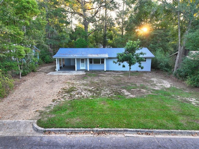 single story home featuring a carport