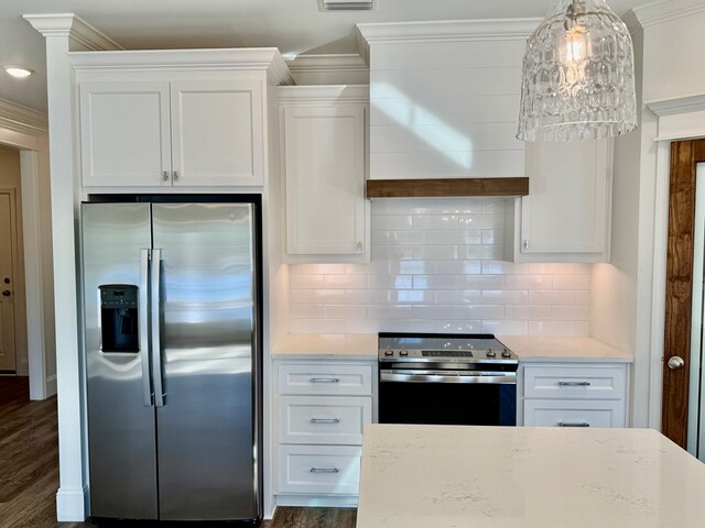 kitchen with tasteful backsplash, light stone countertops, stainless steel appliances, and white cabinets