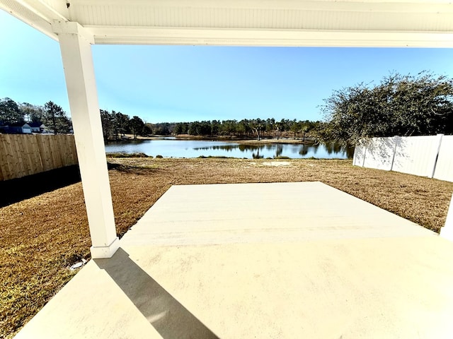 view of patio with a water view