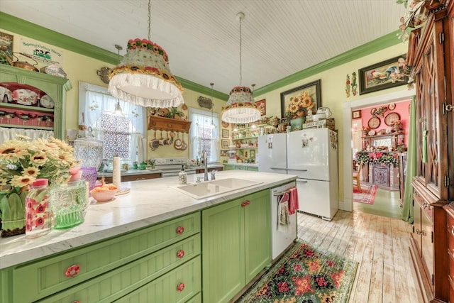 kitchen with hanging light fixtures, dishwasher, and crown molding