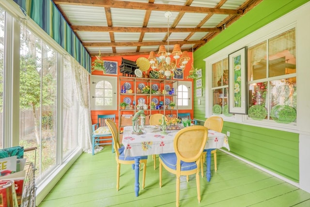 sunroom with a chandelier