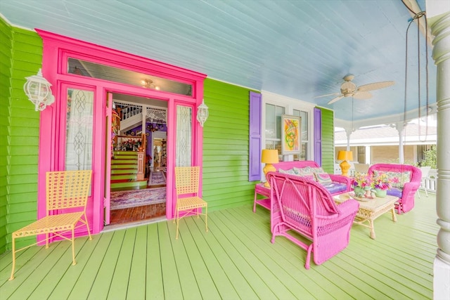 wooden terrace with a porch and ceiling fan