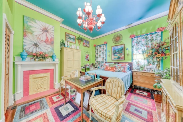 bedroom with crown molding, light hardwood / wood-style flooring, and a notable chandelier