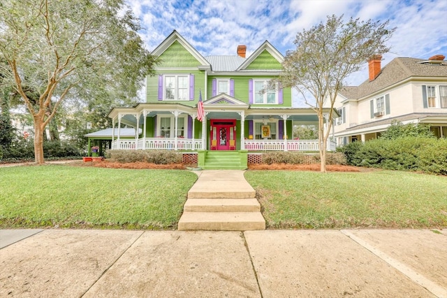 view of front of home featuring a porch and a front yard