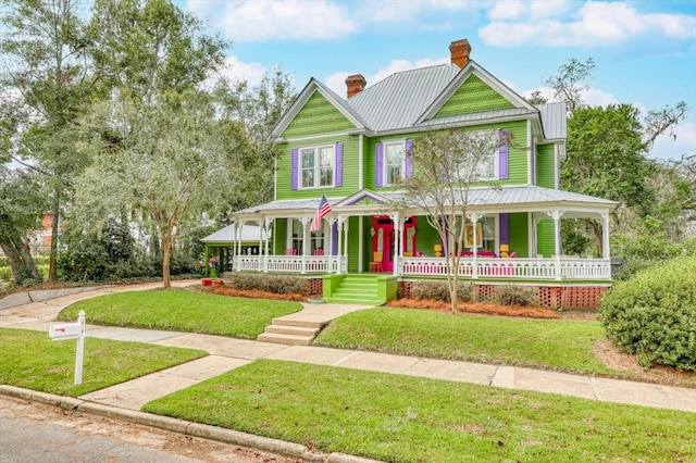 view of front facade with a porch and a front yard