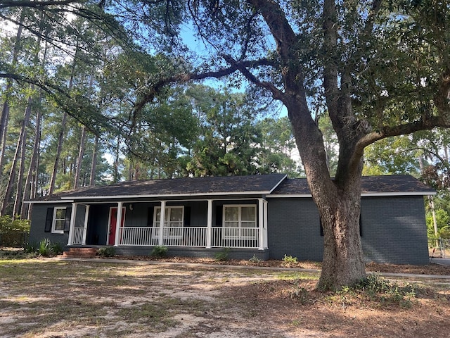 ranch-style home with covered porch