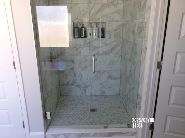 bathroom featuring a shower stall