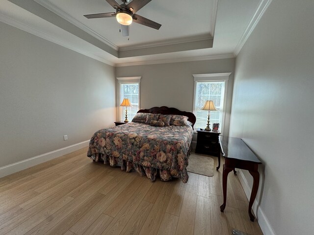 kitchen featuring a breakfast bar, crown molding, stainless steel appliances, white cabinetry, and a sink