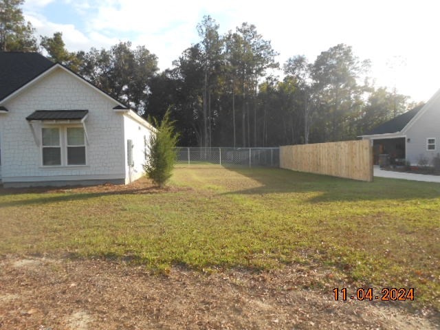 view of yard with fence