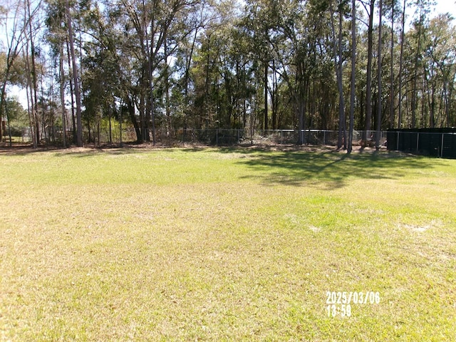 view of yard with fence