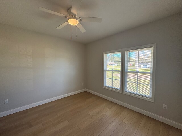 bedroom with light wood-style floors and baseboards