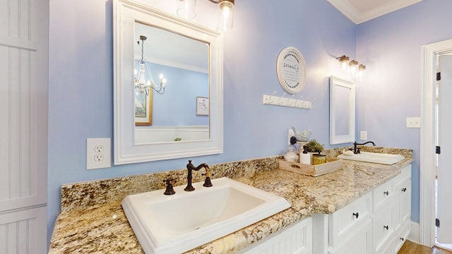 1017 Rowland Rd, Boston, GA 31626 - bathroom with double vanity, crown molding, and a chandelier