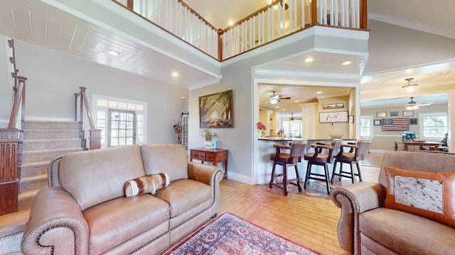 1017 Rowland Rd, Boston, GA 31626 - living area featuring ceiling fan, brick floors, baseboards, ornamental molding, and stairs