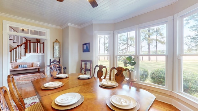 1017 Rowland Rd, Boston, GA 31626 - dining space with a ceiling fan, stairway, and crown molding