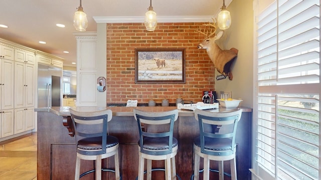 1017 Rowland Rd, Boston, GA 31626 - bar with decorative light fixtures, recessed lighting, light tile patterned floors, and ornamental molding
