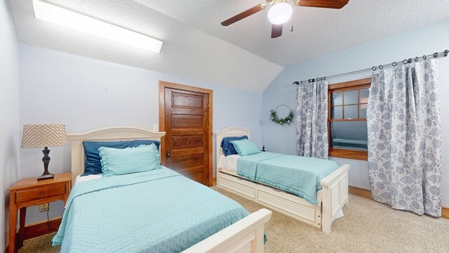 1017 Rowland Rd, Boston, GA 31626 - bedroom featuring vaulted ceiling, carpet flooring, a ceiling fan, a textured ceiling, and baseboards