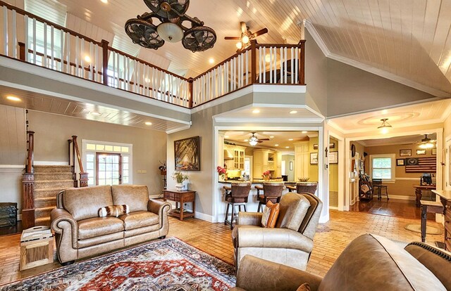 1017 Rowland Rd, Boston, GA 31626 - living area with a ceiling fan, crown molding, high vaulted ceiling, stairway, and baseboards