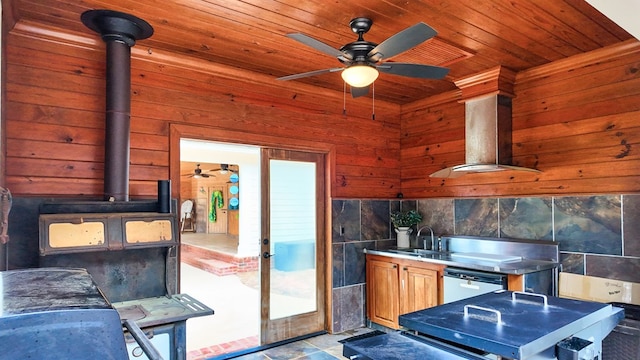 1017 Rowland Rd, Boston, GA 31626 - kitchen featuring ceiling fan, a sink, wood ceiling, a wood stove, and wood walls