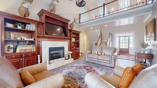 1017 Rowland Rd, Boston, GA 31626 - living room with stairway, a fireplace, and a towering ceiling