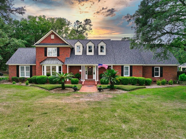 1017 Rowland Rd, Boston, GA 31626 - view of front facade with brick siding, a front yard, and a shingled roof