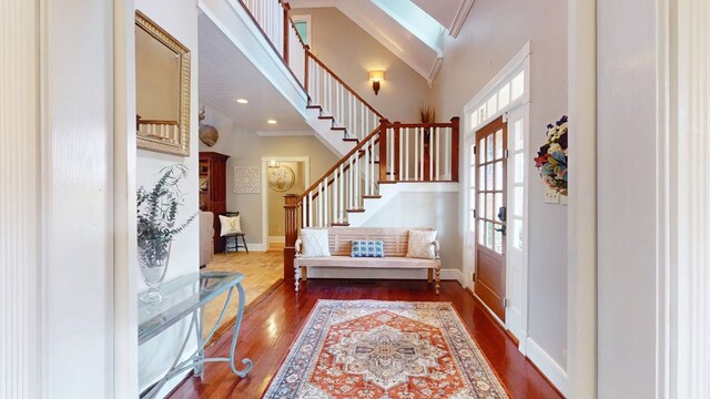 1017 Rowland Rd, Boston, GA 31626 - foyer featuring a towering ceiling, dark wood-style flooring, stairway, baseboards, and a skylight