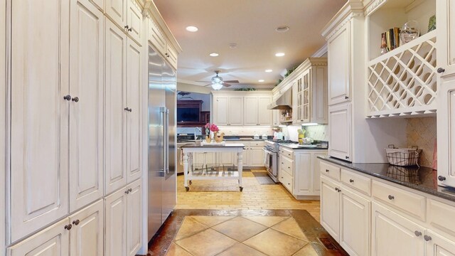 1017 Rowland Rd, Boston, GA 31626 - kitchen featuring inlaid floor details, high end appliances, recessed lighting, ceiling fan, and backsplash