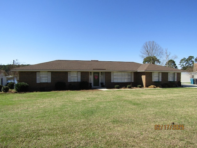 ranch-style house with a front yard