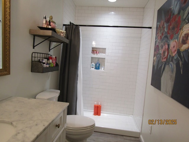 bathroom with vanity, toilet, and a shower with curtain