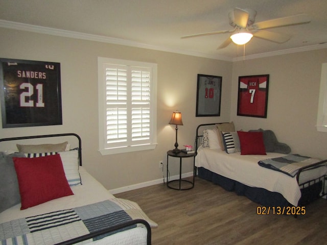 bedroom with hardwood / wood-style floors, crown molding, and ceiling fan