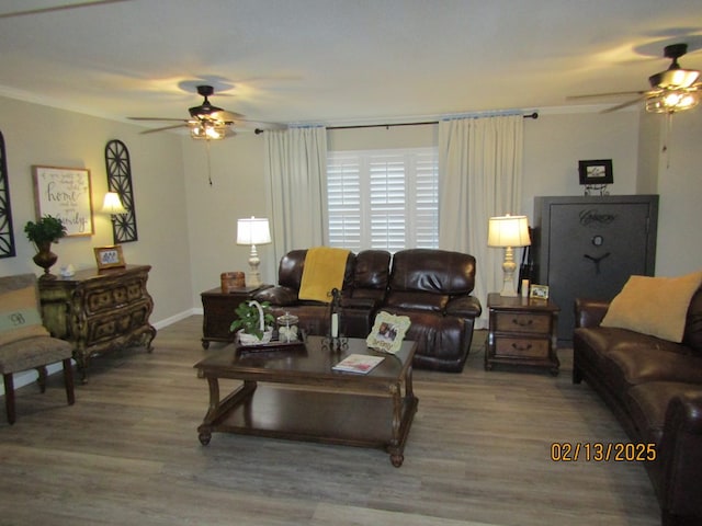 living room with hardwood / wood-style floors and ceiling fan