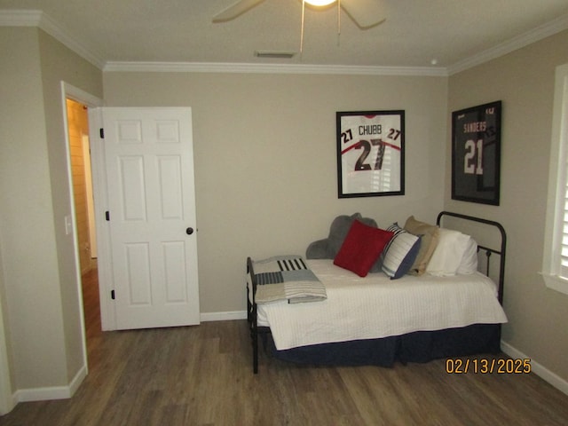 bedroom featuring crown molding, dark hardwood / wood-style floors, and ceiling fan