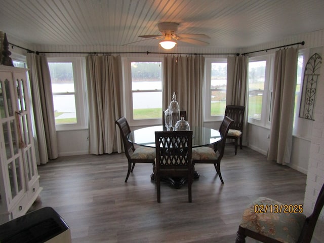 dining space with wood-type flooring, ceiling fan, and wood ceiling