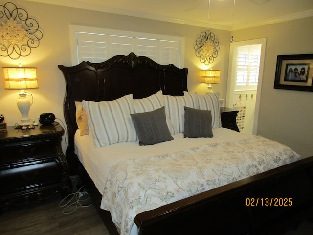 bedroom featuring hardwood / wood-style floors and crown molding