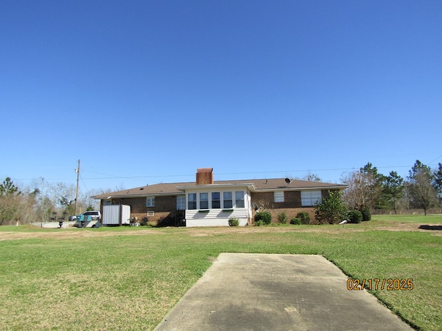 ranch-style house with a front lawn