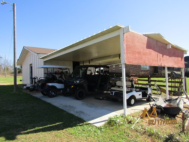 view of car parking featuring a lawn